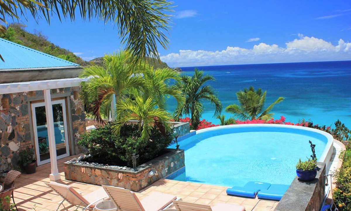 Estate Rendezvous and Ditlef Villa | Carnival Beach House Awaits: Relax in Style with Beachfront Views, A/C, and a Private Pool!
