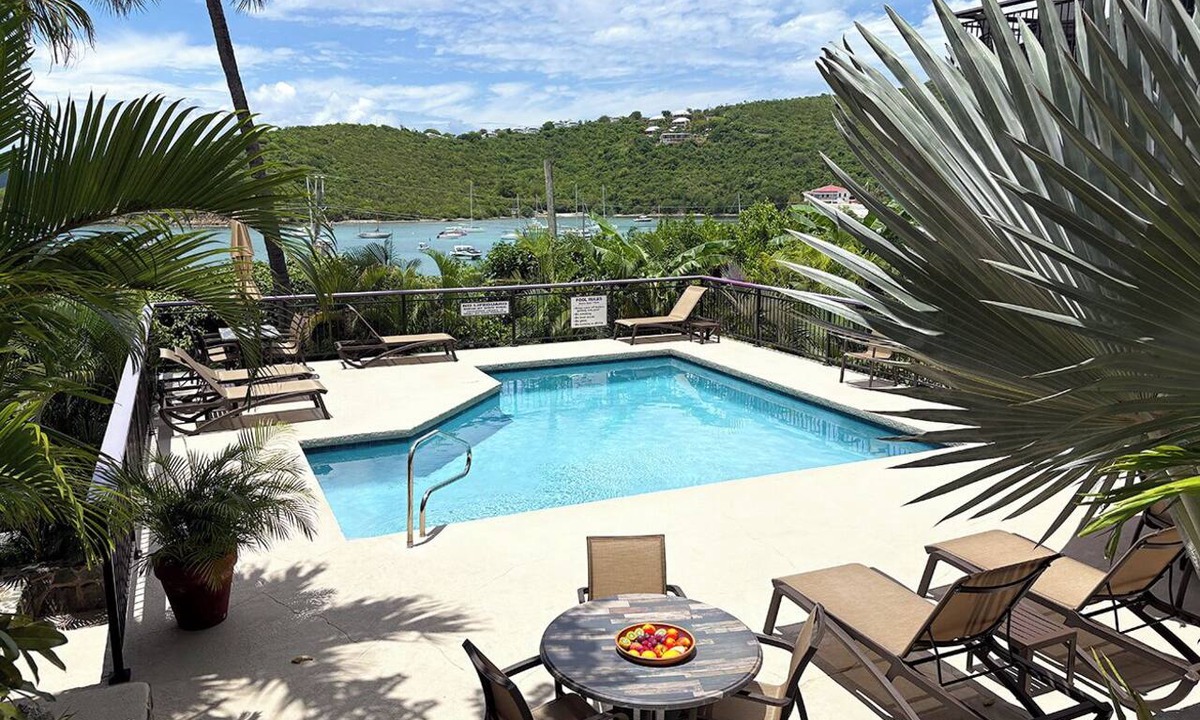Estate Enighed Condo | This exceptional property offers the convenience of being just a short stroll from Cruz Bay, all while providing the comfort of full air conditioning. Don't miss out on this perfect blend of location and luxury!