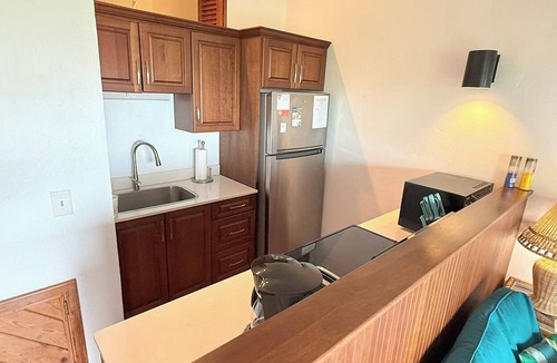 Estate Enighed Condo | Charming Corner Condo with A/C, Stunning Water Views, and Gorgeous Sunsets!