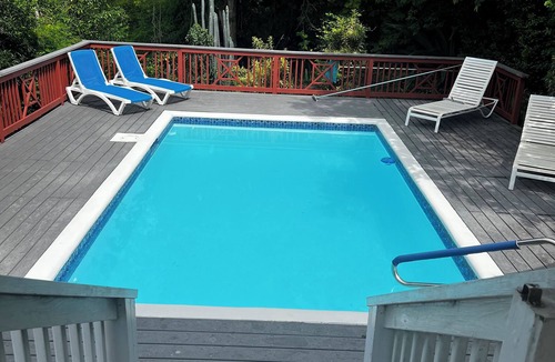 Monte Villa | Classic Comfortable Caribe style villa with an expansive porch and pool.