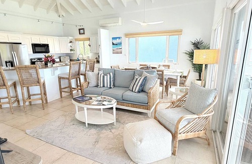 Estate Enighed Condo | Experience the exquisite Mango Serenity, a spacious condo that offers breathtaking views and an abundance of comfort. Discover your perfect getaway today!