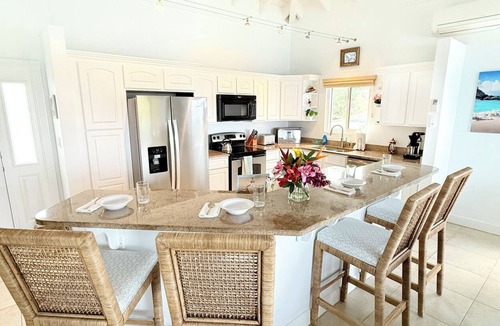 Estate Enighed Condo | Experience the exquisite Mango Serenity, a spacious condo that offers breathtaking views and an abundance of comfort. Discover your perfect getaway today!