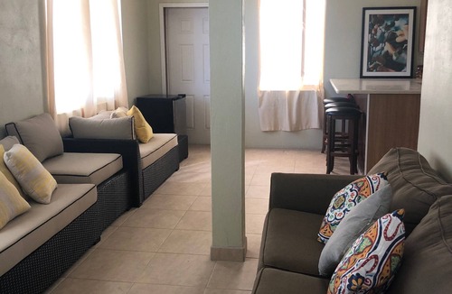 Estate Whim House | Large hillside one bedroom apartment with a sea view.