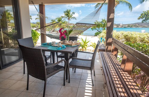 Red Hook Condo | Luxurious Beachfront Condo: May- August Savings! Paradise at your toes!