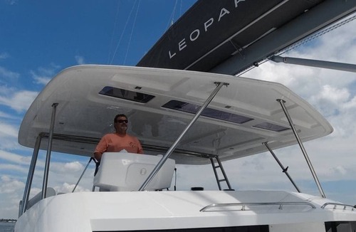 Flag Hill Boat Rental | Luxury Catamaran with Four Bedrooms, Fwd and Aft Deck, Private Patio, Swim Lift.