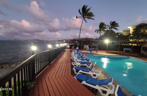 Christiansted Condo | St Croix Escape. Gated condo complex with pool, restaurant, bar and beach.