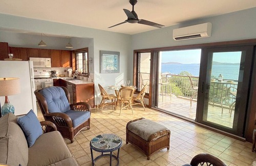 Estate Enighed Condo | This exceptional property offers the convenience of being just a short stroll from Cruz Bay, all while providing the comfort of full air conditioning. Don't miss out on this perfect blend of location and luxury!