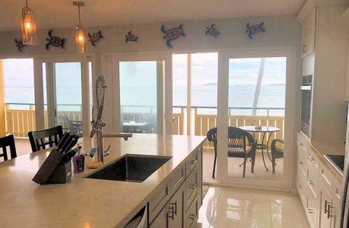 Estate Golden Rock Condo | WE SHELL SEA - 2 bed/2 bath beachfront condo- beach and pool.